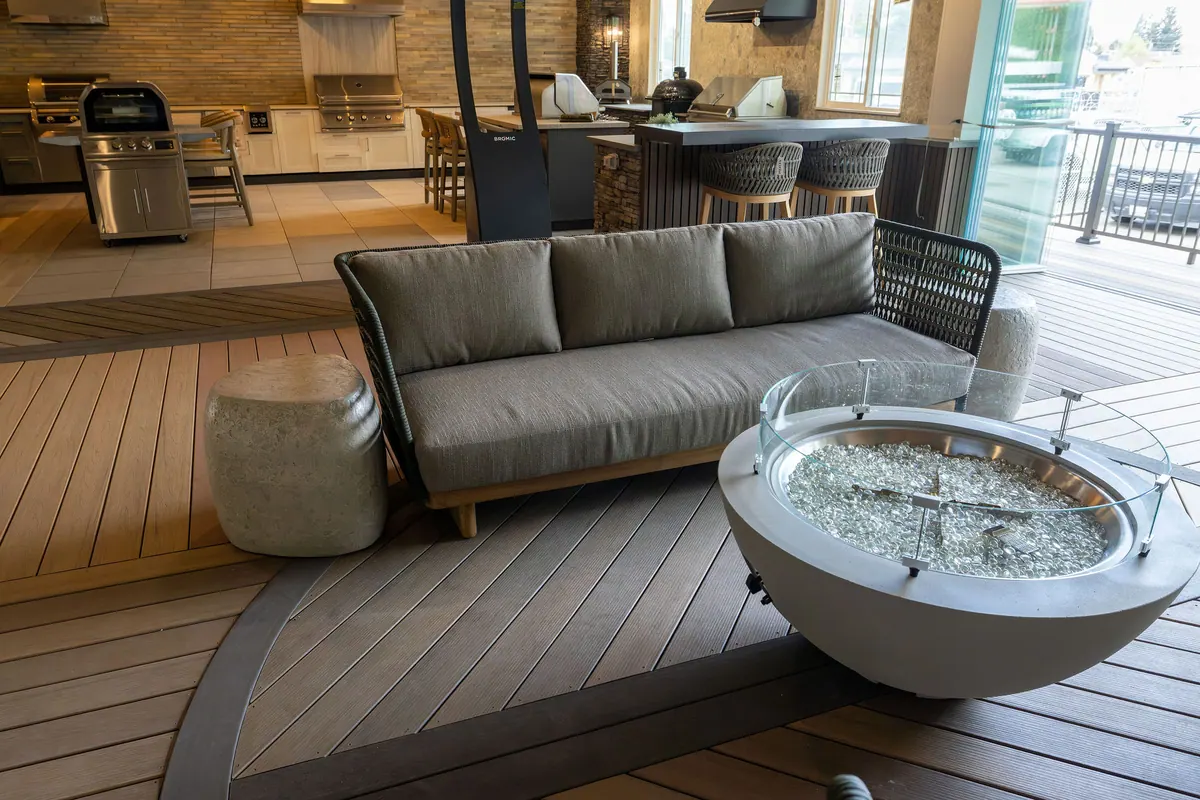 Outdoor sofa and fire table on a composite deck