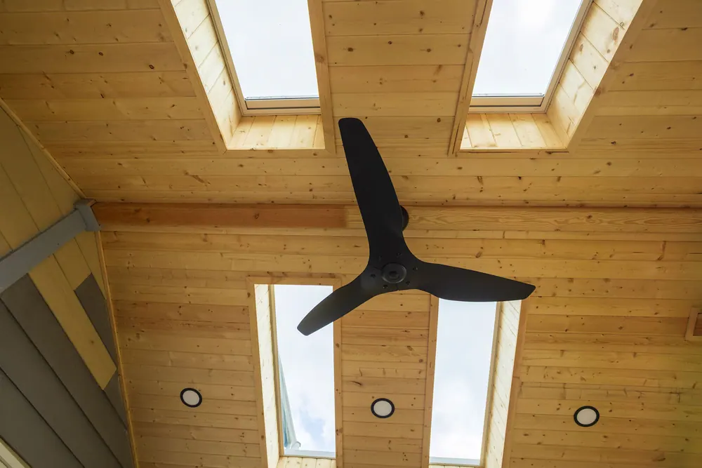 Cedar-lined Timberline patio cover with skylights, recessed lighting and a fan